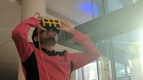 Man in Startrek uniform using a cell phone VR set