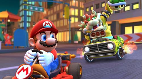 Bowser chases after Mario in an intense yet brotherly match of Mario Kart.