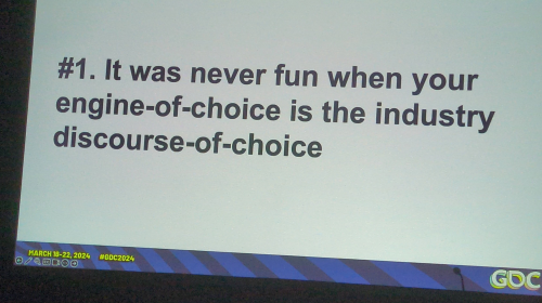 A photo of a slide from the "Flash Games Postmortem, Part 2" session at GDC 2024. It reads "#1. It was never fun when your engine-of-choice is the industry discourse-of-choice"