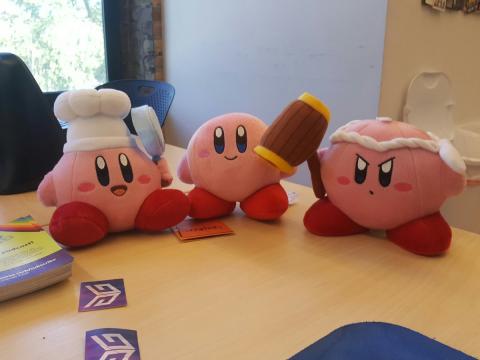 Three Kirby Plushies hang out on Stephen's desk