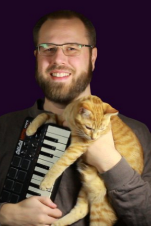 Portrait of Ben Burnes, an electronic Keyboard and a Cat, who wishes Ben would put them down