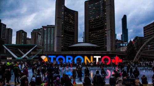 People Gathered in Front of Toronto Freestanding Signage