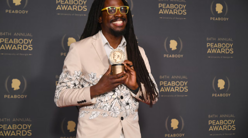 Jarryd Huntley posing for photos and holding a Peabody Award (Photo by Alberto Rodriguez/Variety)