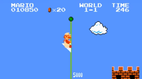 Mario sliding down the flagpole World 1-1 Super Mario Bros