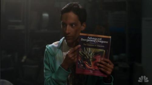 A picture of Abed from the show Community with the Advanced Dungeons and Dragons rulebook.