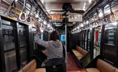 In a very old subway car at the NY Transit Museum