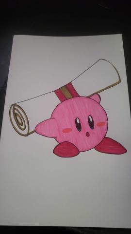 Picture of Kirby holding a diploma.