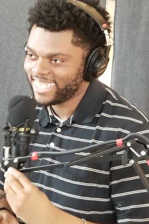 Stephen smiling while recording an episode